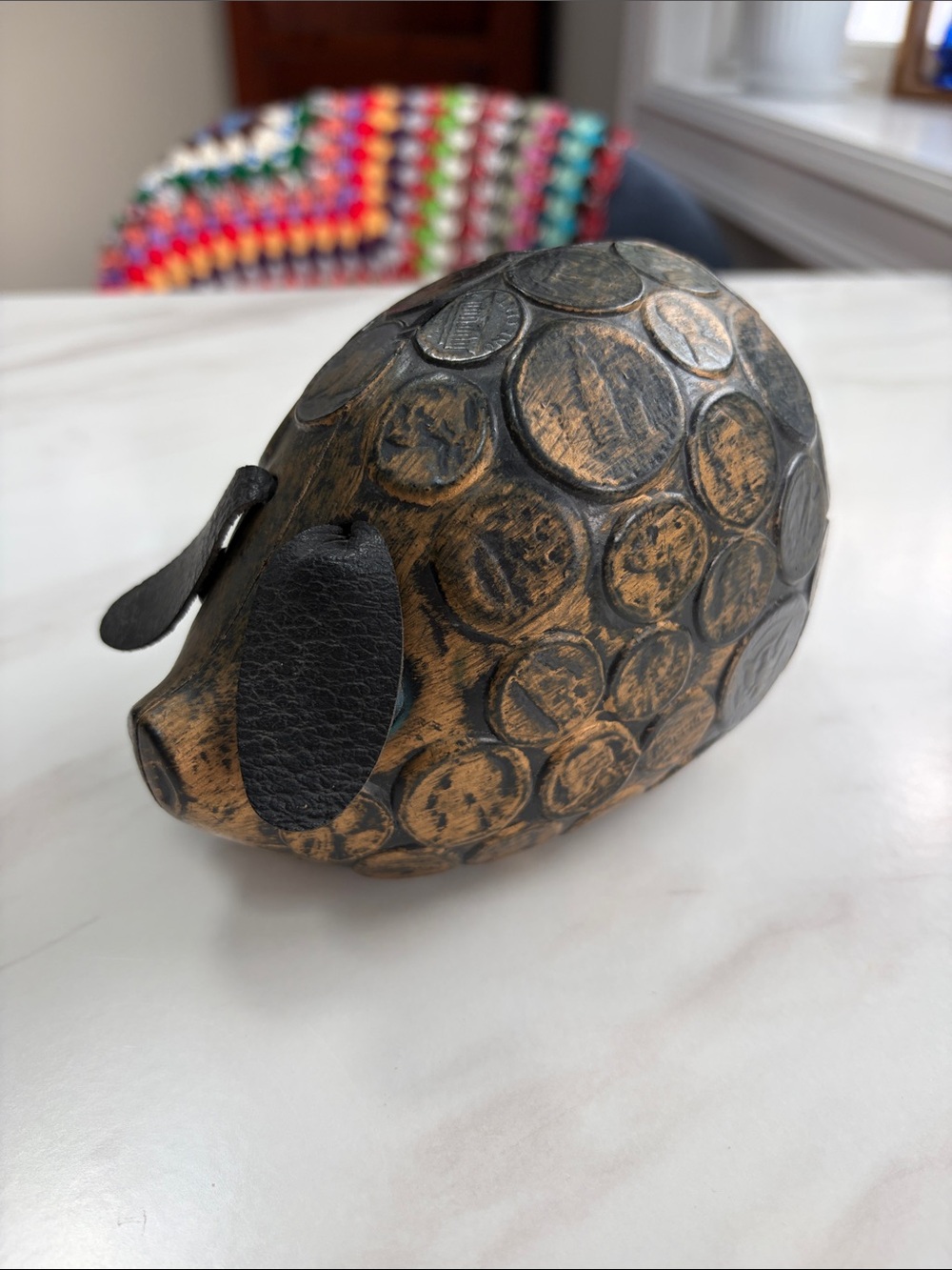 Vintage plastic piggy bank coin-embossed surface and floppy faux leather ears